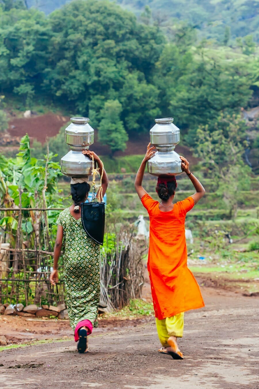 Villagers carrying water in an Indian village